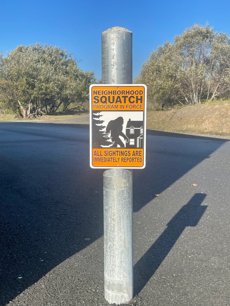 NEIGHBORHOOD SQUATCH Metal Sign