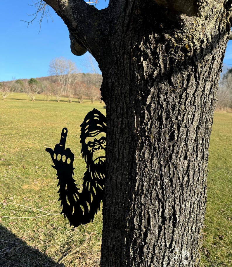 Flipping Off Bigfoot Metal Sign