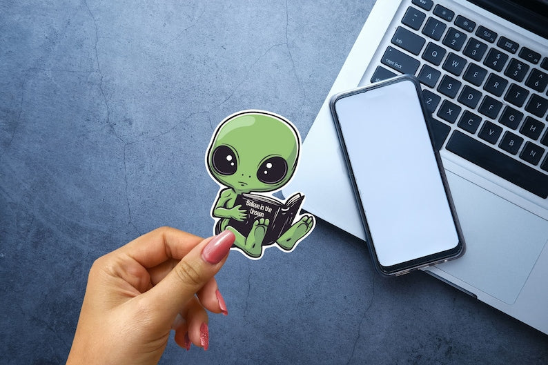 Adorable Green Alien Reading Sticker
